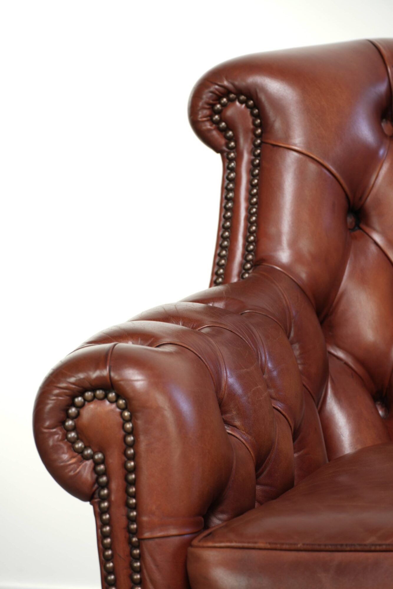 Cognac-coloured cow leather Chesterfield armchair in English style