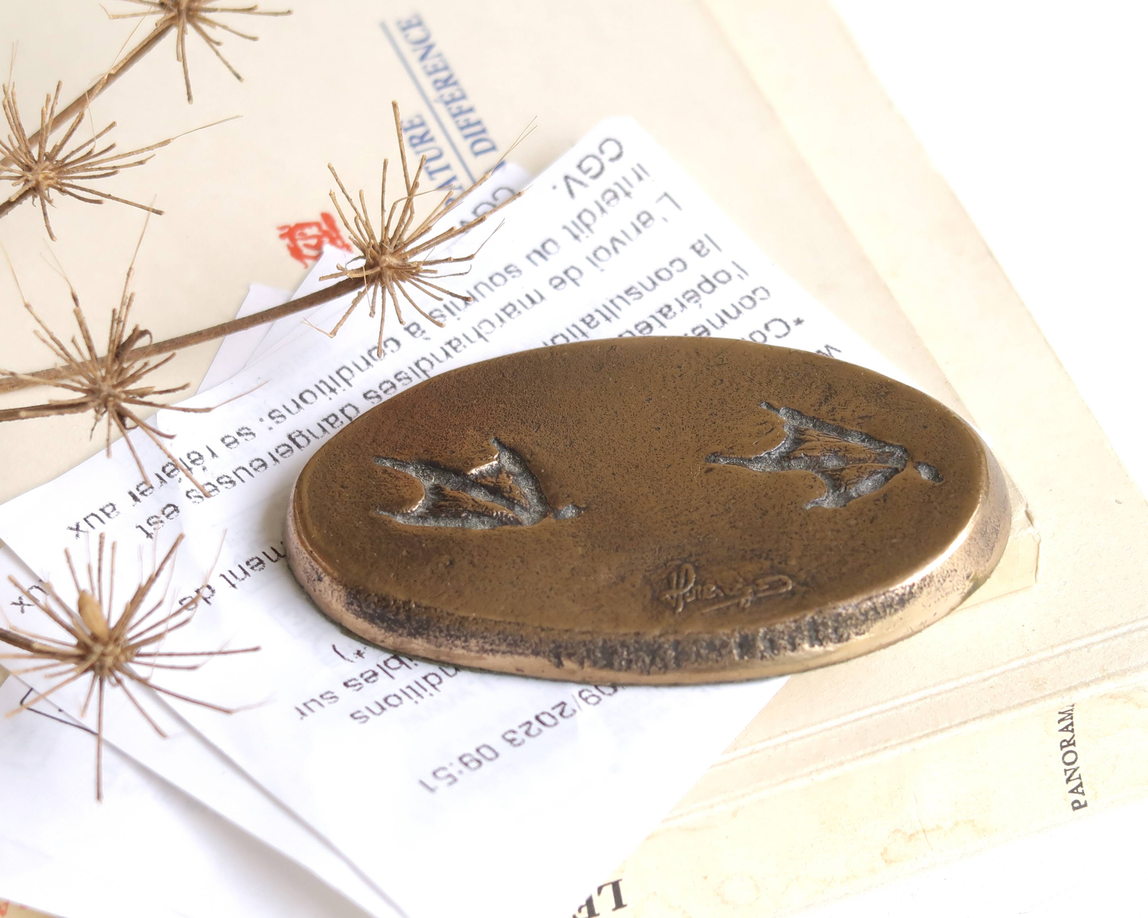 Signed bronze paperweight, 1993