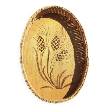Vintage wall-mounted wicker and pyrographed wood bread basket