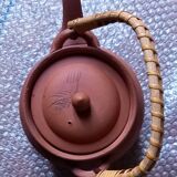 Terracotta and rattan teapot