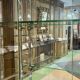 Early 20th-century shop display cabinet in oak with sliding doors.