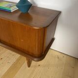 Vintage teak sideboard with rounded edges and sliding doors – mid-century Scandinavian design.
