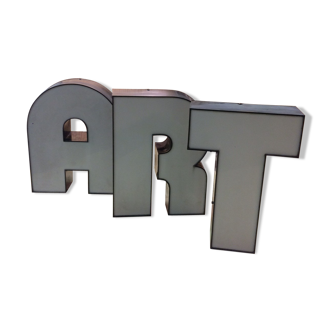 3 letters of old sign forming the word ART