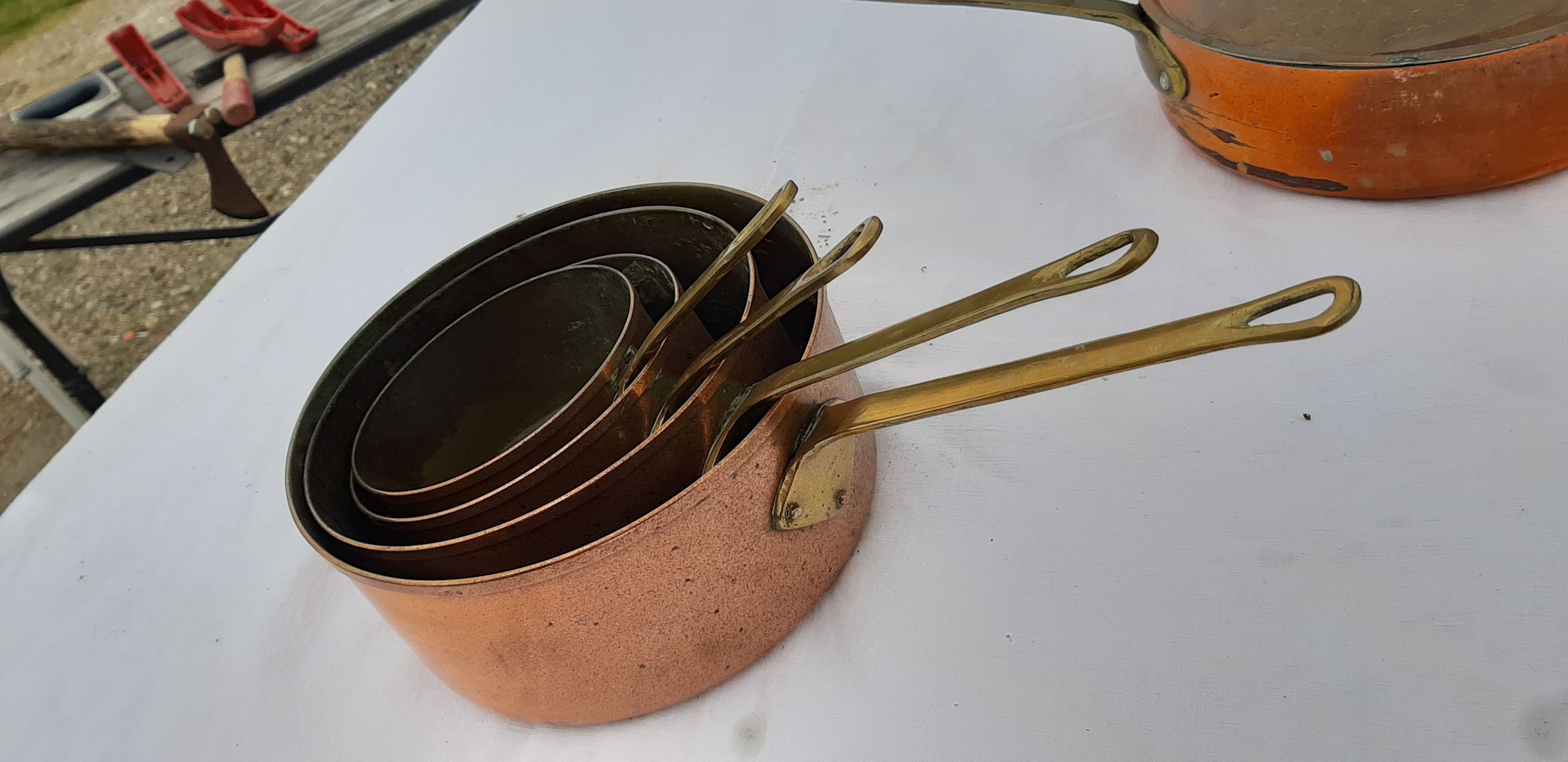 Lots of tinned copper kitchen utensils