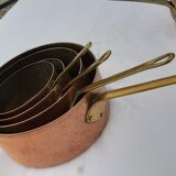 Lots of tinned copper kitchen utensils