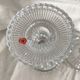 Column candle holders in moulded glass made in France.