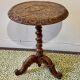 Carved wooden pedestal table