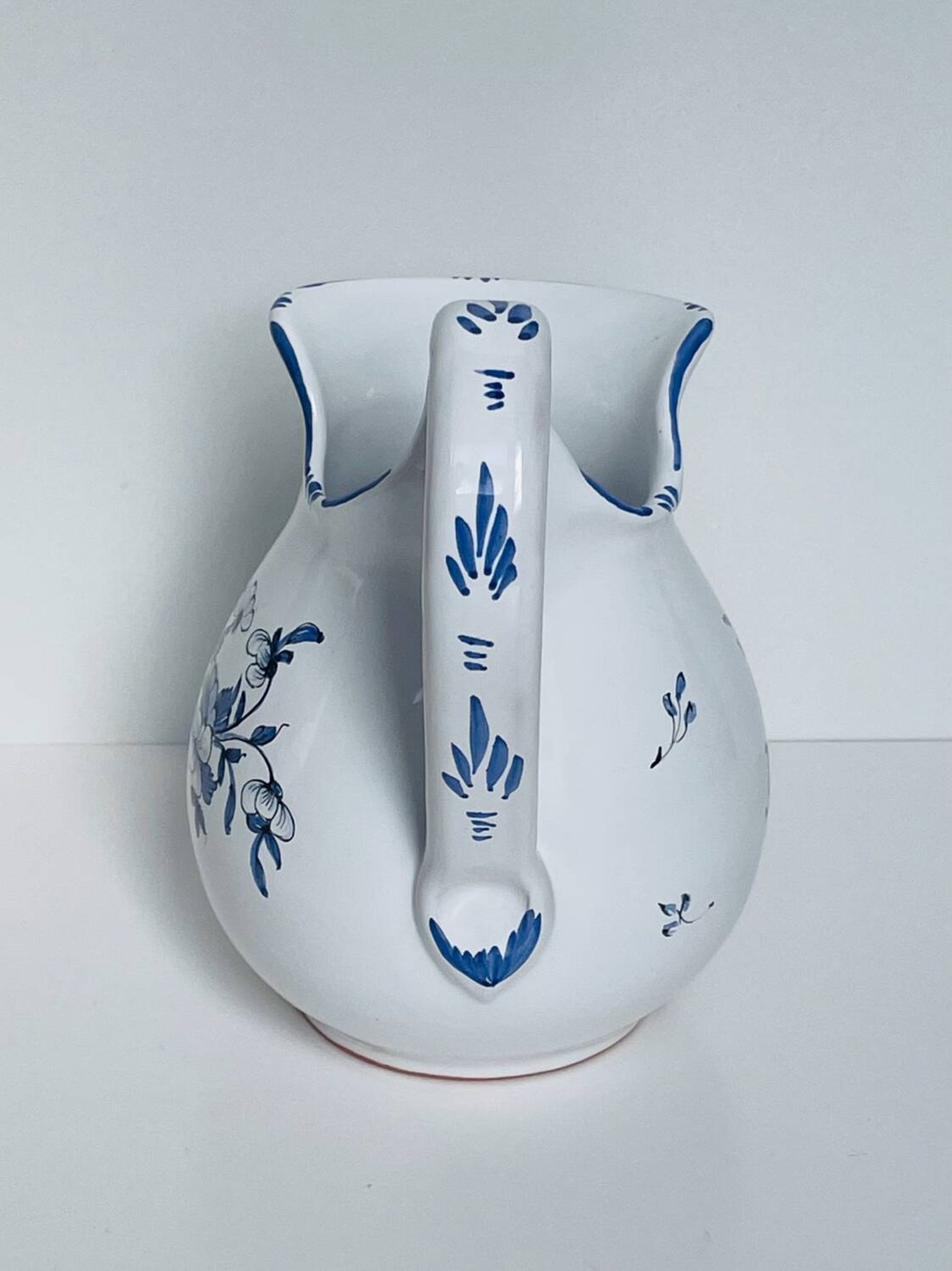 Moustiers pitcher with blue floral decoration