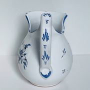 Moustiers pitcher with blue floral decoration