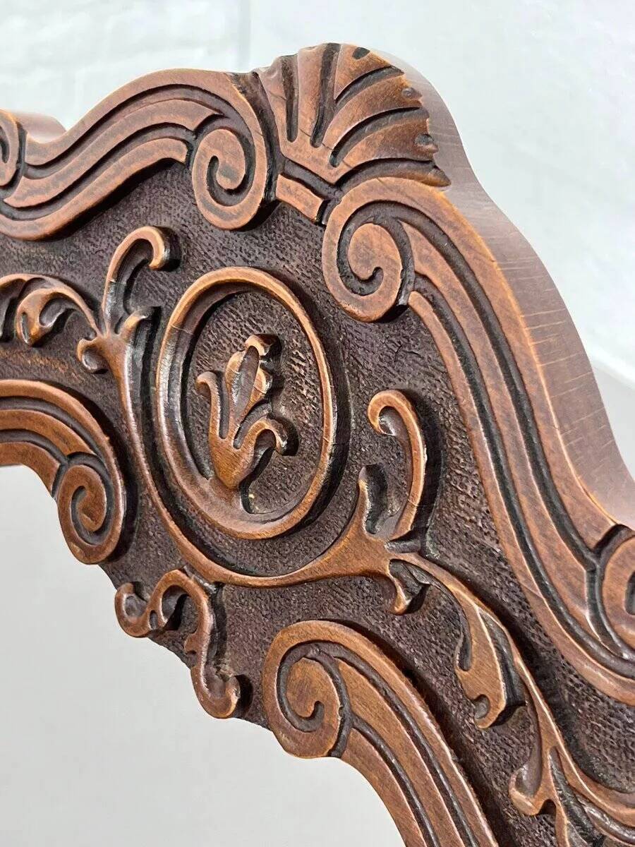 Vintage folding chair in carved wood