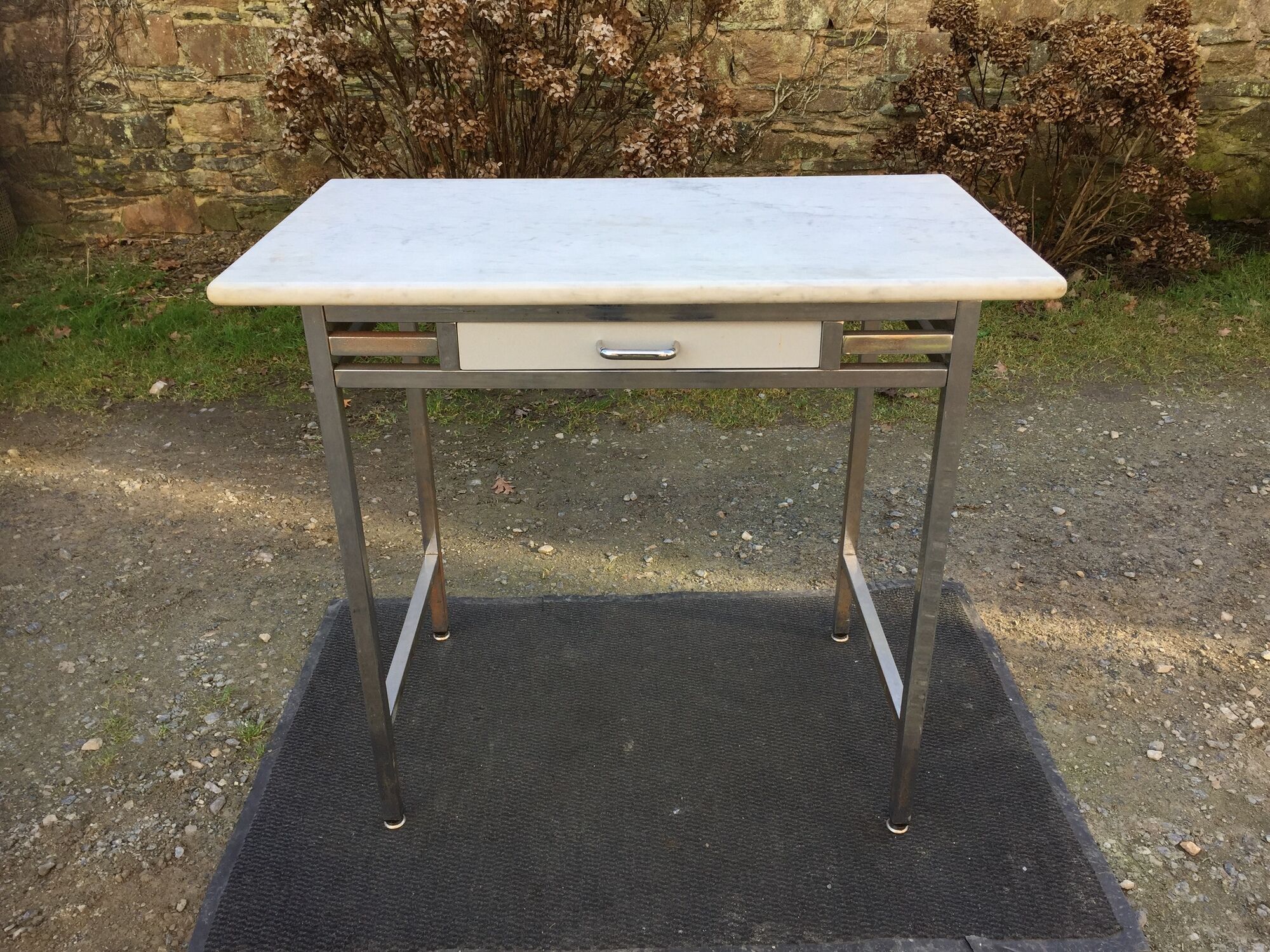 Vintage table with square chrome tubular metal base and marble top with 1 drawer.