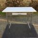 Vintage table with square chrome tubular metal base and marble top with 1 drawer.