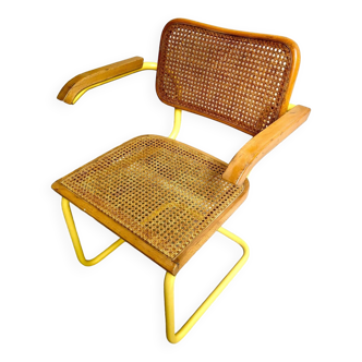 Armchair in yellow metal, wood and light canework