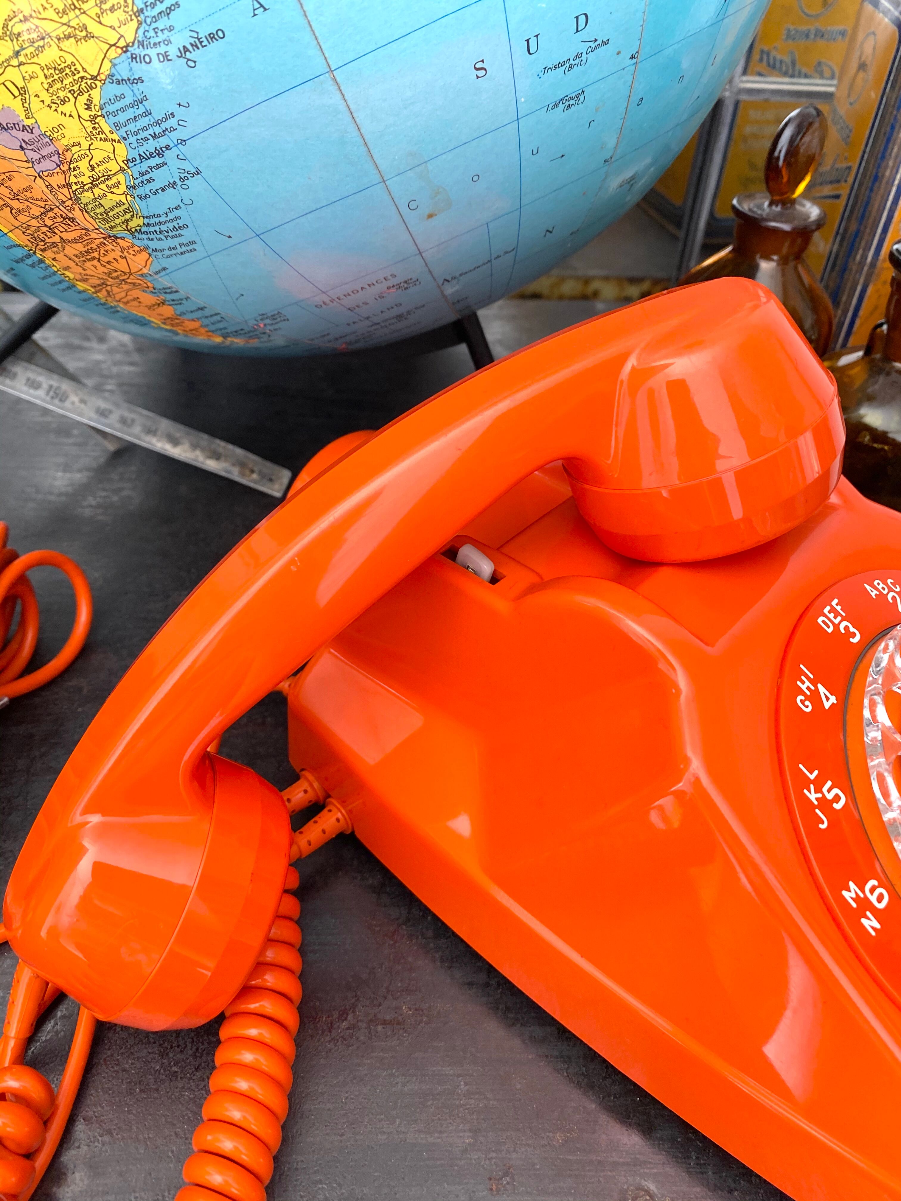 Orange vintage dial phone
