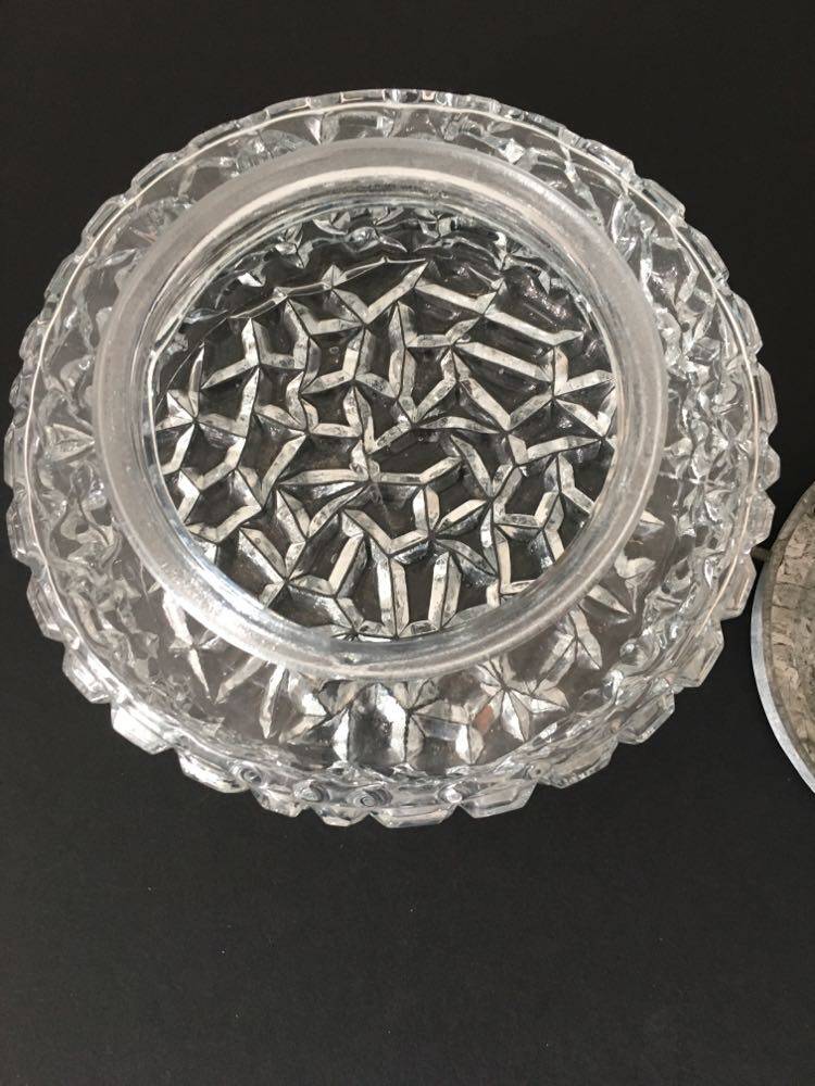 Round ceiling or wall lamp in worked glass. Gray metal support