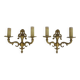 Pair of two-armed fire pot wall lights in gilded bronze.