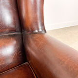 Vintage dark brown sheep leather wingback armchair