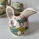 Japanese-style tea set in cracked earthenware with chrysanthemum flowers