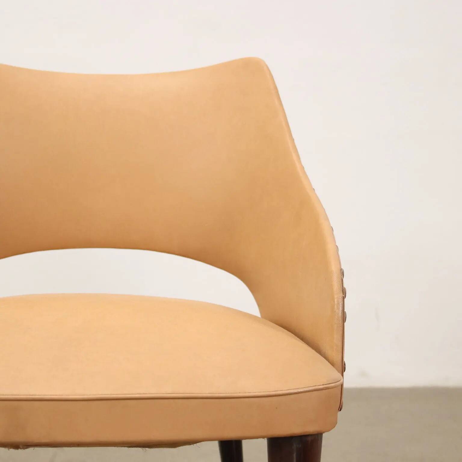 Pair of vintage armchairs from the 50s-60s in ebony wood, brass, with padded seats.
