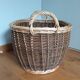 Very large oval laundry basket in two-tone braided wicker with handles
