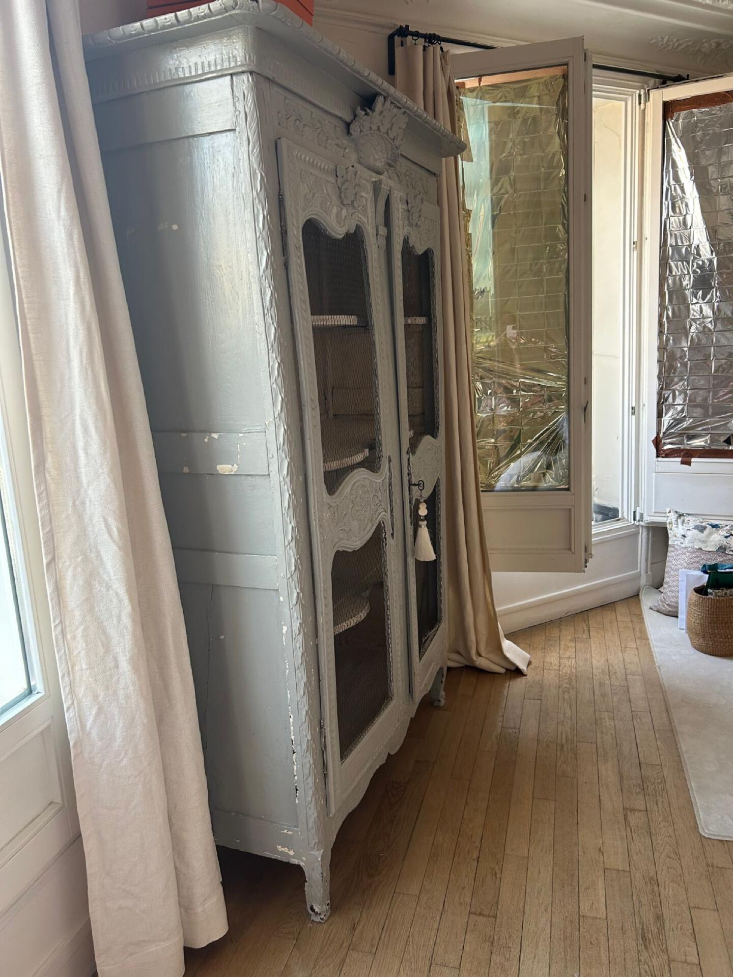 Antique French carved display cabinet with wire mesh doors