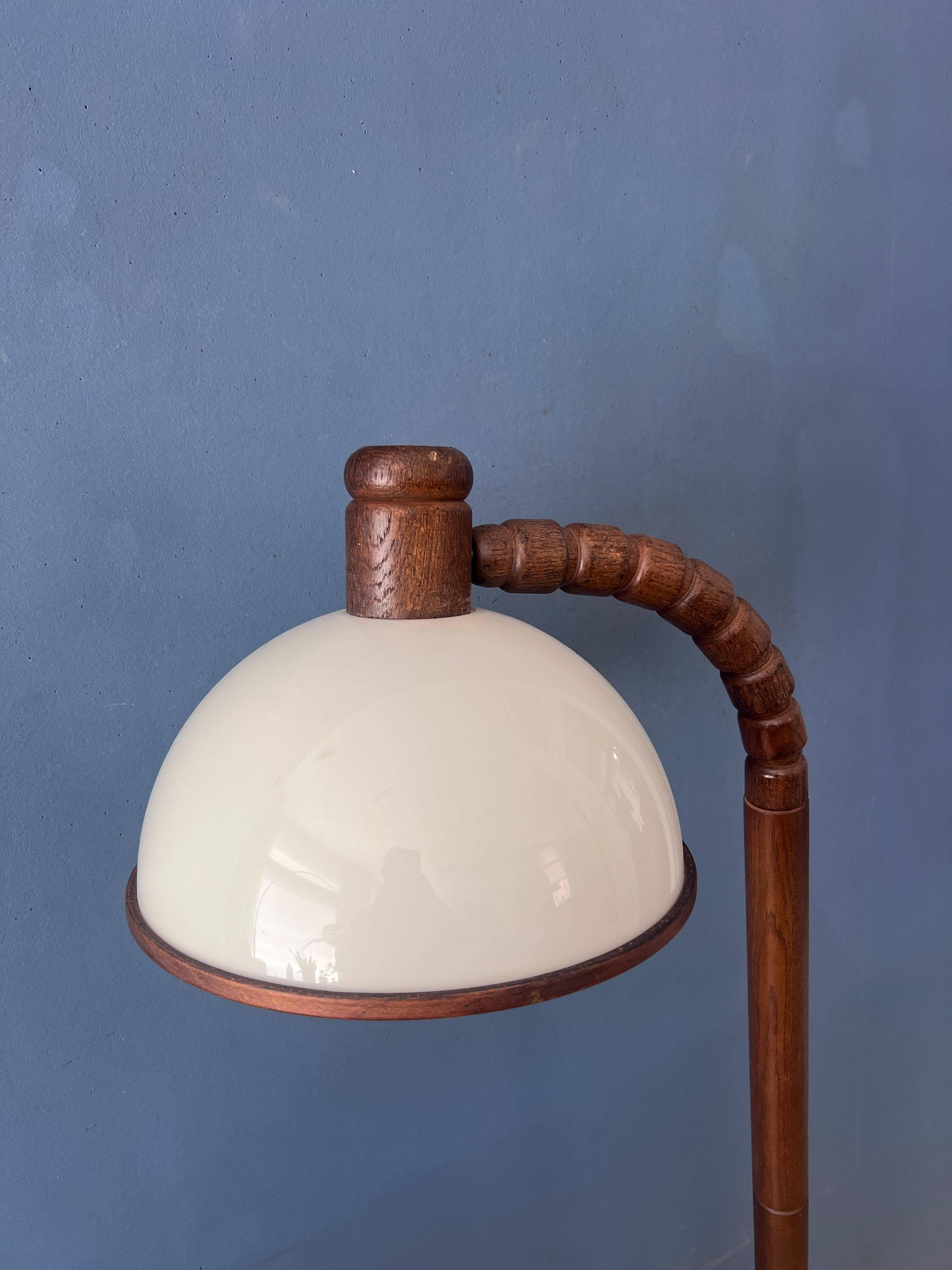 Mid-century floor lamp in brown wood by Steinhauer with an acrylic glass shade.