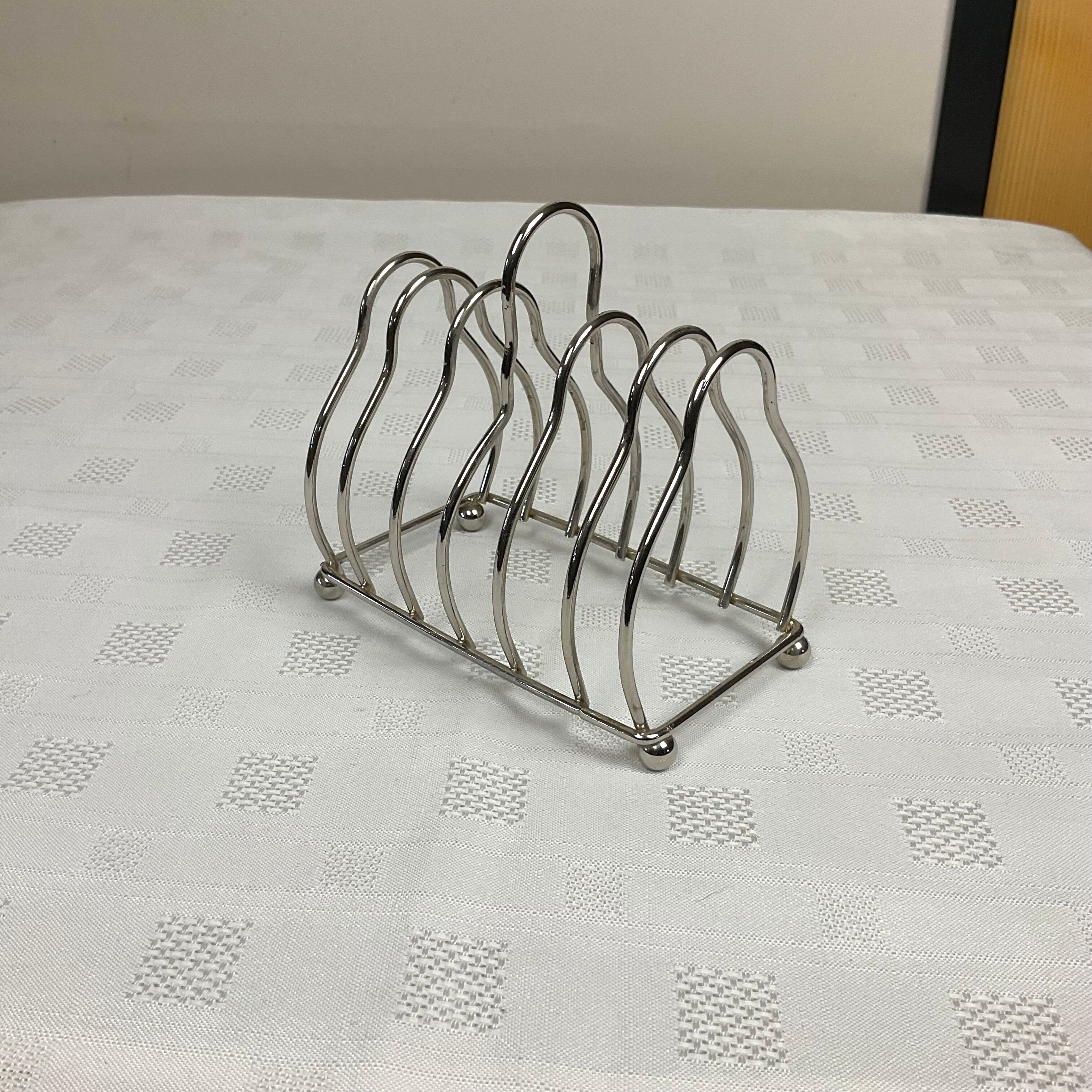 Toast holder in silver metal