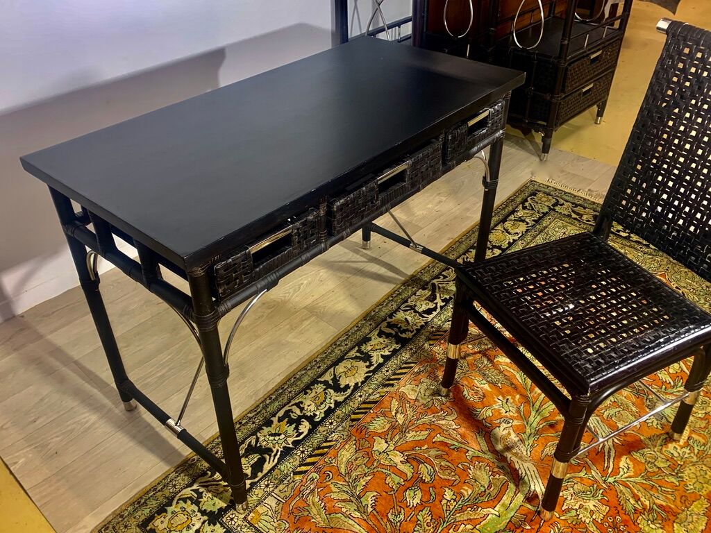 Office with its rattan armchair and brown leather braiding, italian design