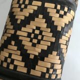 Ethnic decorative bottle in leather and raffia braiding