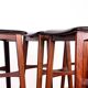 4 Danish high stools, rosewood and black leather, Knud Bent for Dyrlund.