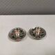 Silver-plated candle holders with inlaid red and green enamel