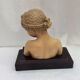 Girl's head in terracotta numbered