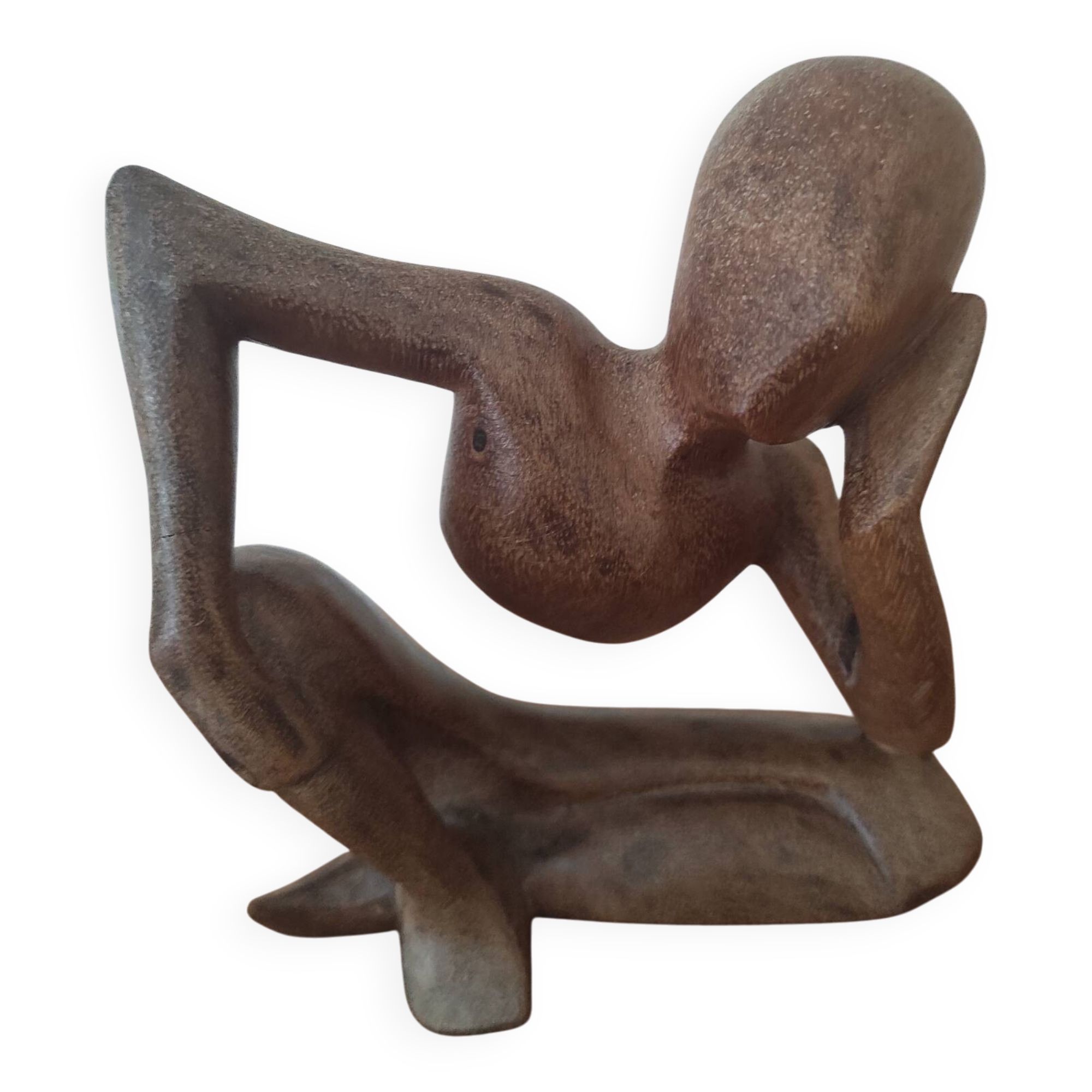 Wooden sculpted statuette of a woman in a pensive pose.