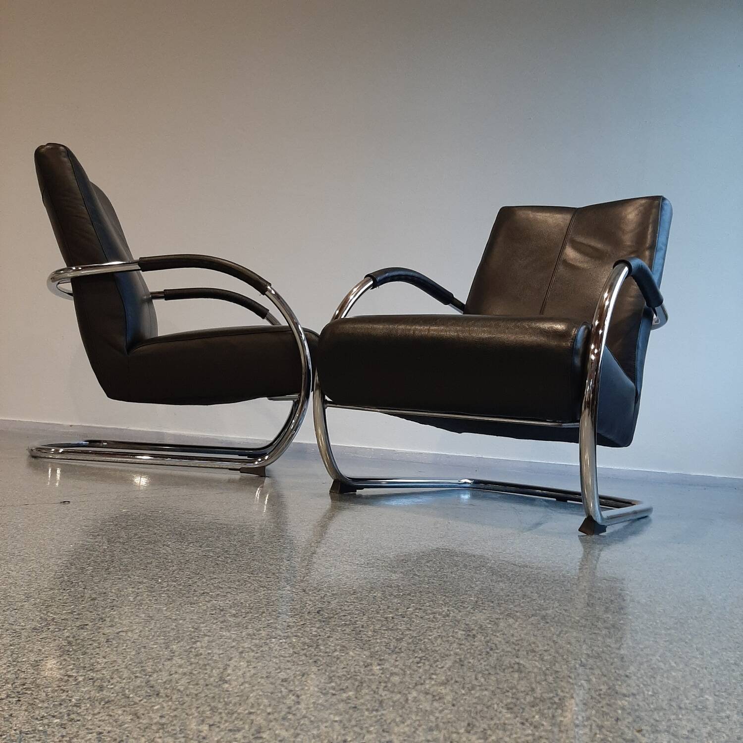 Pair of tubular armchairs