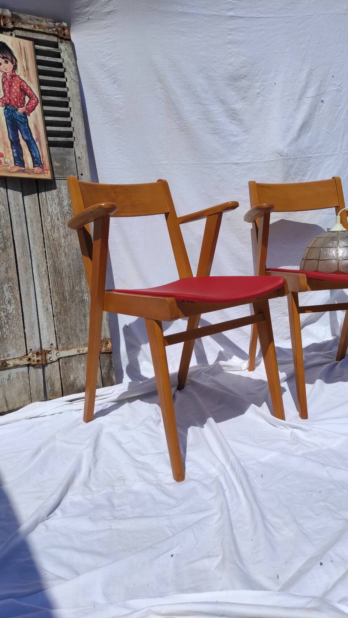 Pair of wooden armchairs and skaï foot compass of the 50s