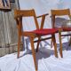Pair of wooden armchairs and skaï foot compass of the 50s
