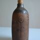 Bottle vase decorative flowers ceramic signature with fish to identify.