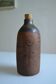 Bottle vase decorative flowers ceramic signature with fish to identify.