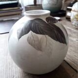 Vintage vase with plant decoration