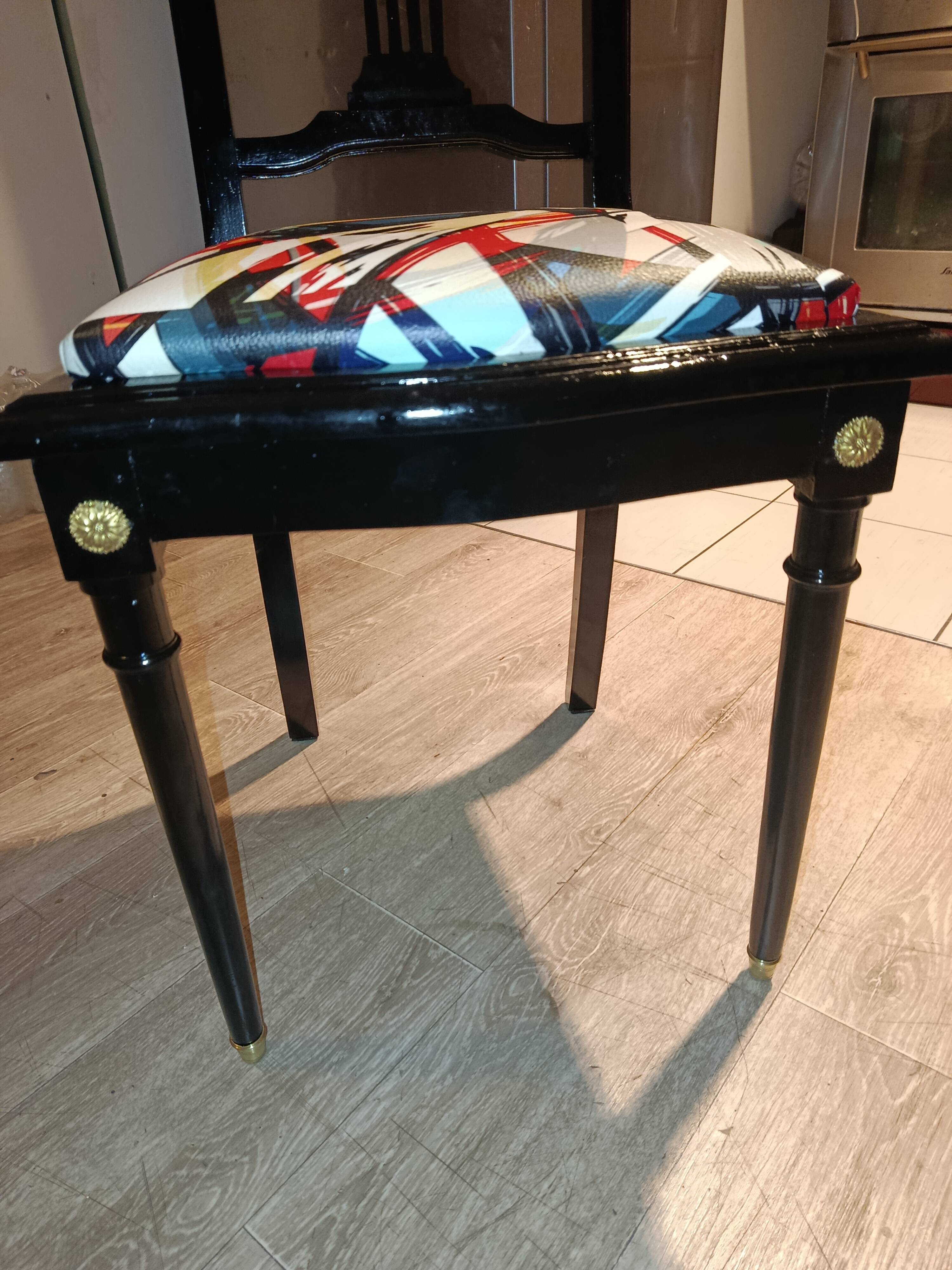 Pair of Hepplewhite neoclassical style chairs, relooked in black lacquer and faux leather.