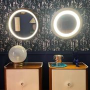 Backlit mirror designed by Gio Ponti in wood and lacquer. Italy, 1970s.