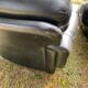 Pair of black imitation leather armchairs