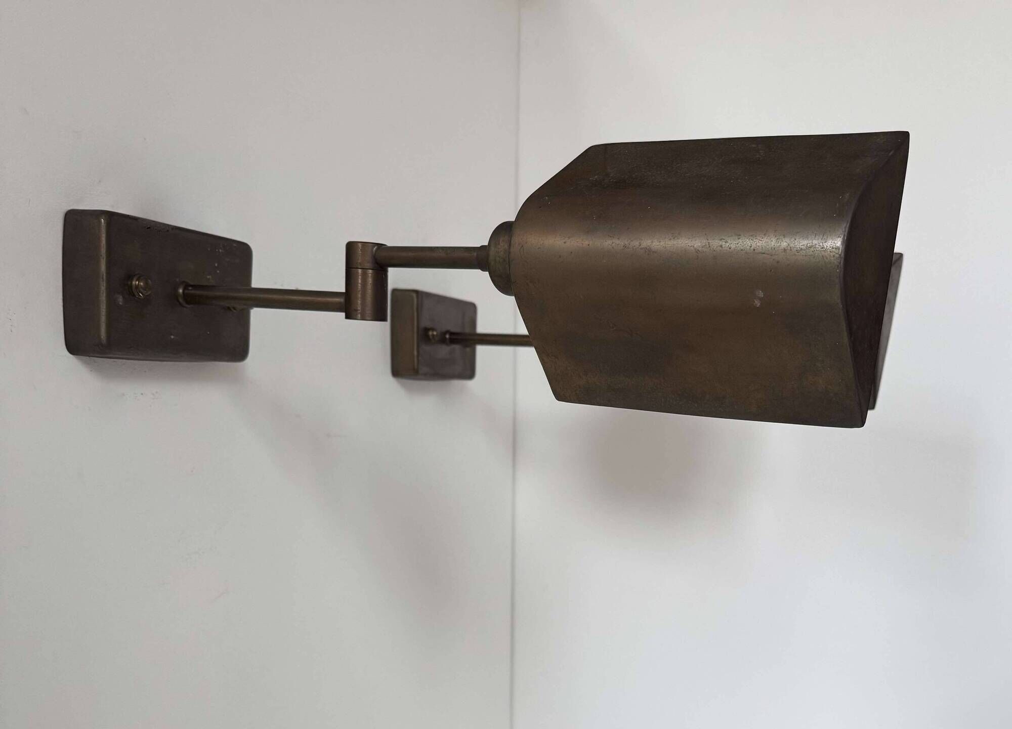 Pair of vintage adjustable wall lights, patinated brass, France 1970.