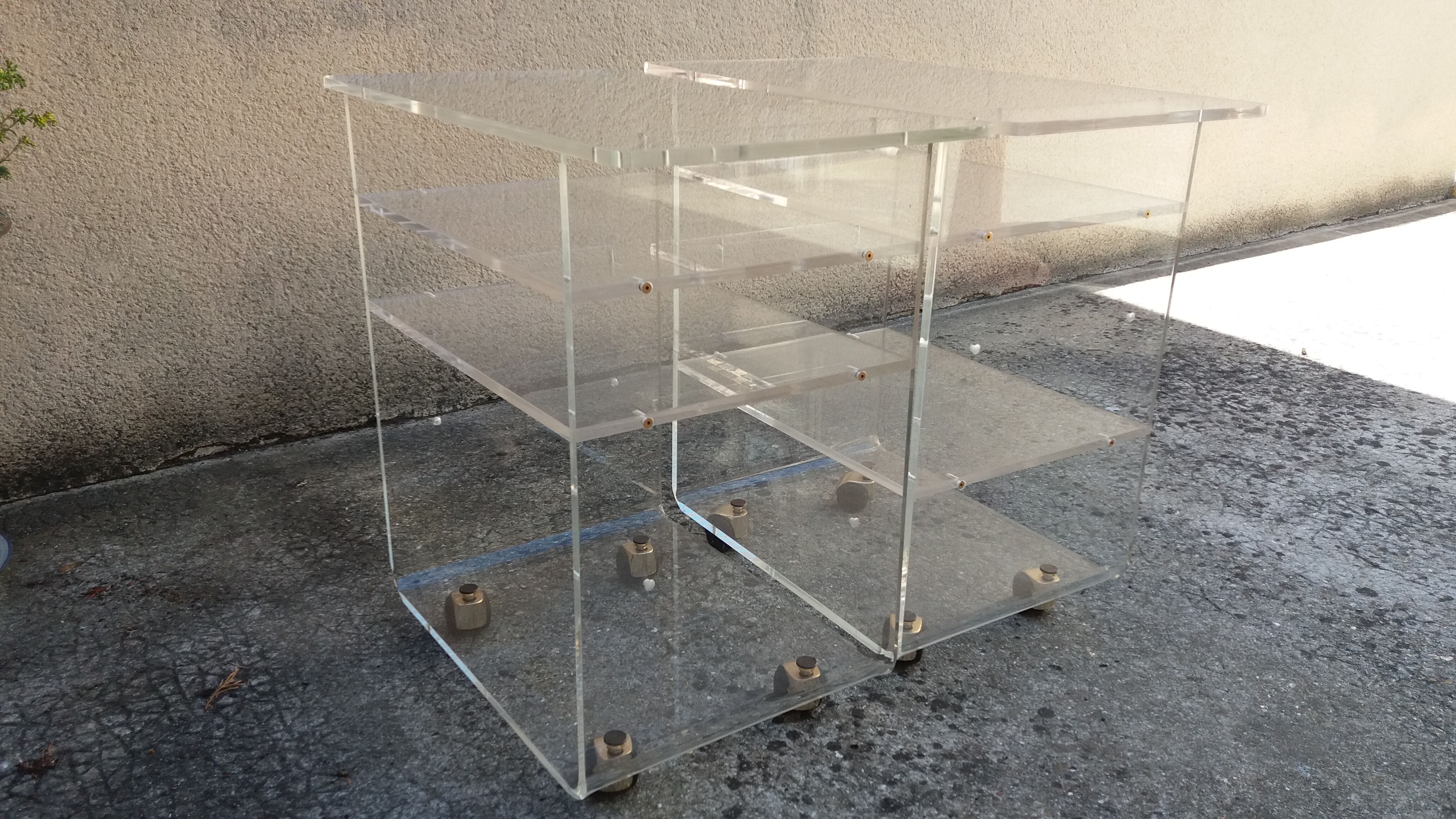 Pair of Plexiglas services branded "Les Invisibles du Marais"