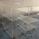 Pair of Plexiglas services branded "Les Invisibles du Marais"