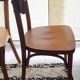 Set of 4 light wood bistro chairs stamped Baumann and Thonet.