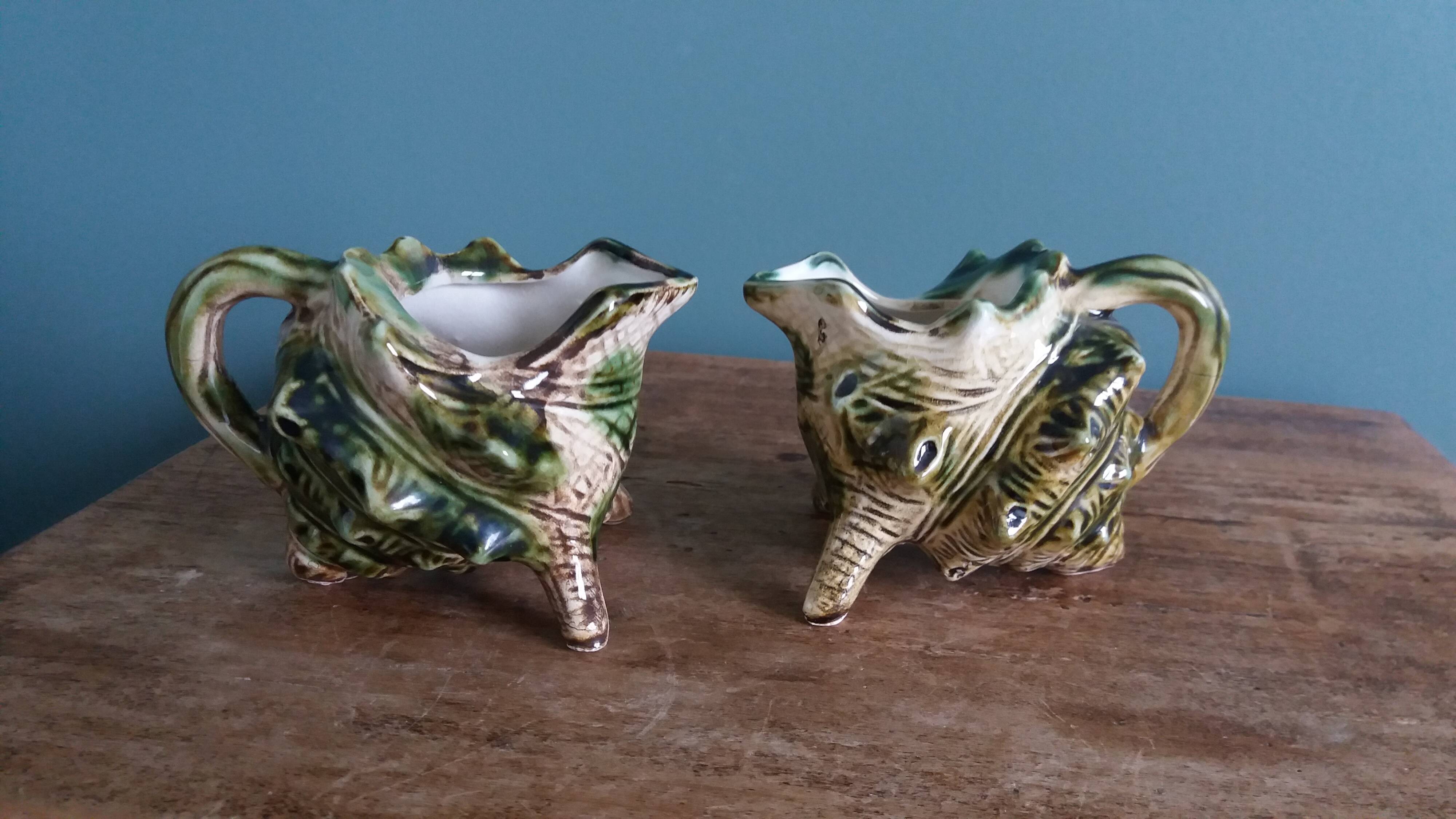 Animal-shaped milk jug shell in slipware.