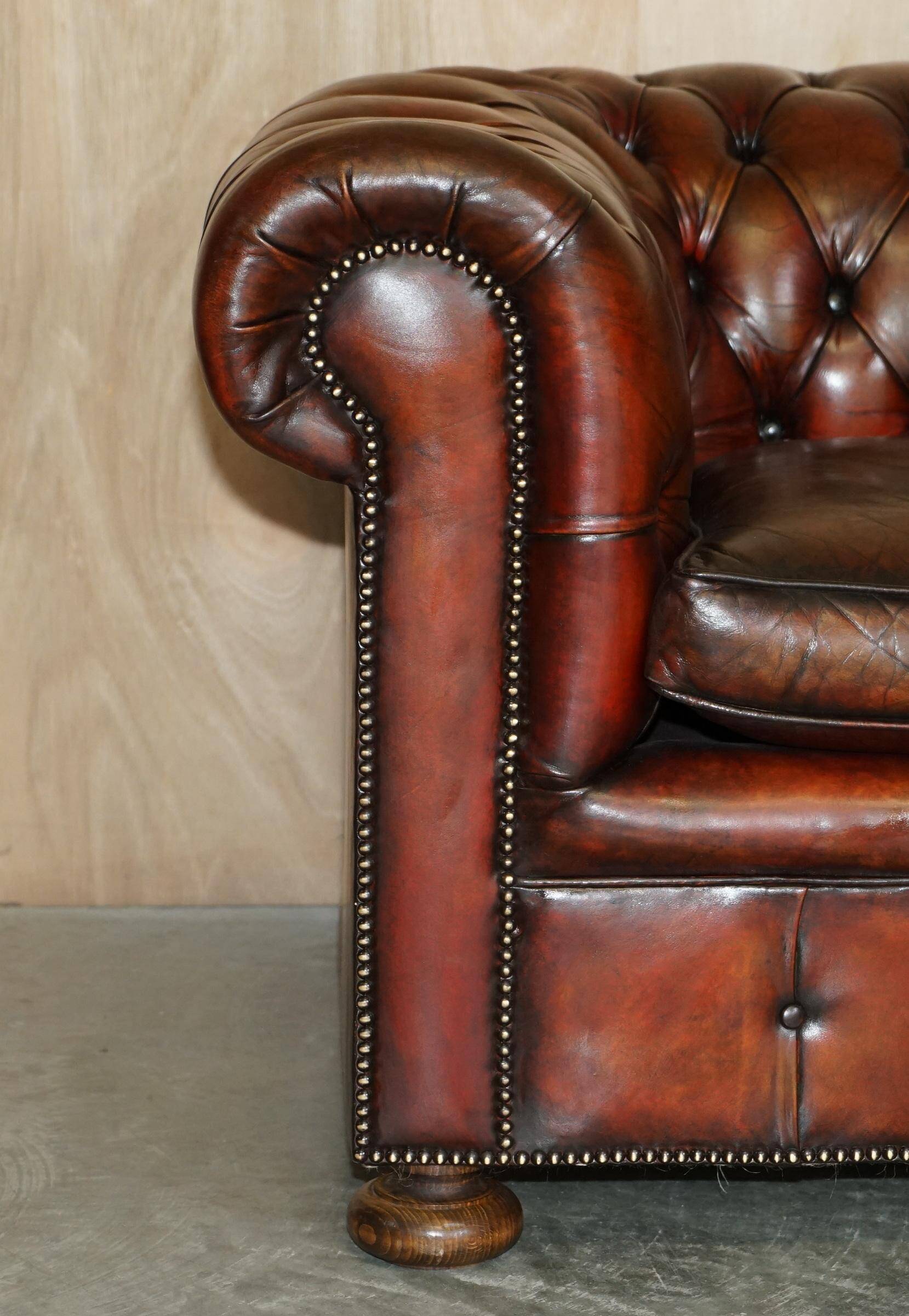 Pair of restored antique Chesterfield sofas in Boudreaux leather.