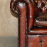 Pair of restored antique Chesterfield sofas in Boudreaux leather.