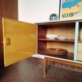 Wooden sideboard in soft green